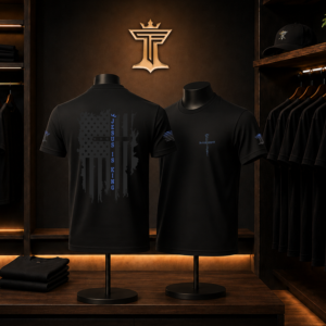 Black Jesus is King shirt mockup with distressed American flag back design and blue vertical lettering in a dark boutique display.