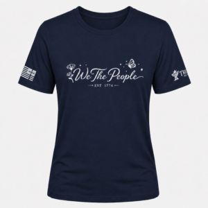 Navy We the People crew neck shirt with white floral, butterfly, and EST 1776 graphic.
