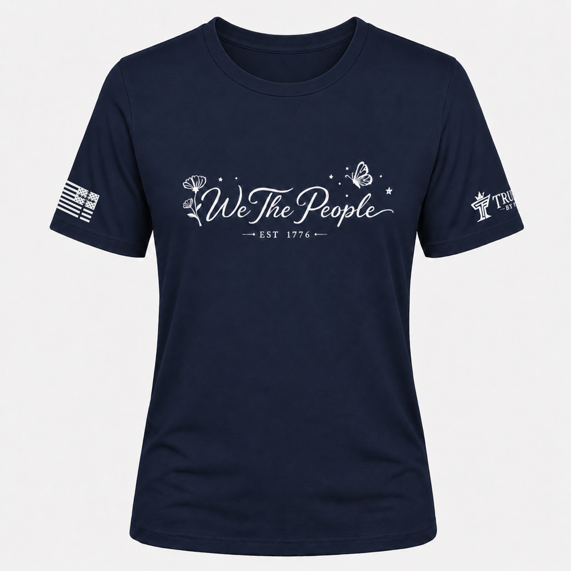 Navy We the People crew neck shirt with white floral, butterfly, and EST 1776 graphic.