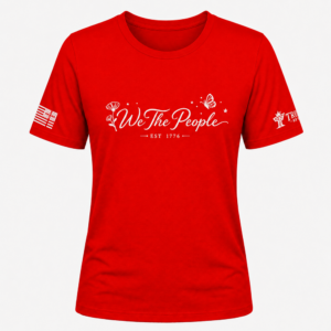 Red We the People crew neck shirt with white script lettering, floral accents, butterfly, and EST 1776.