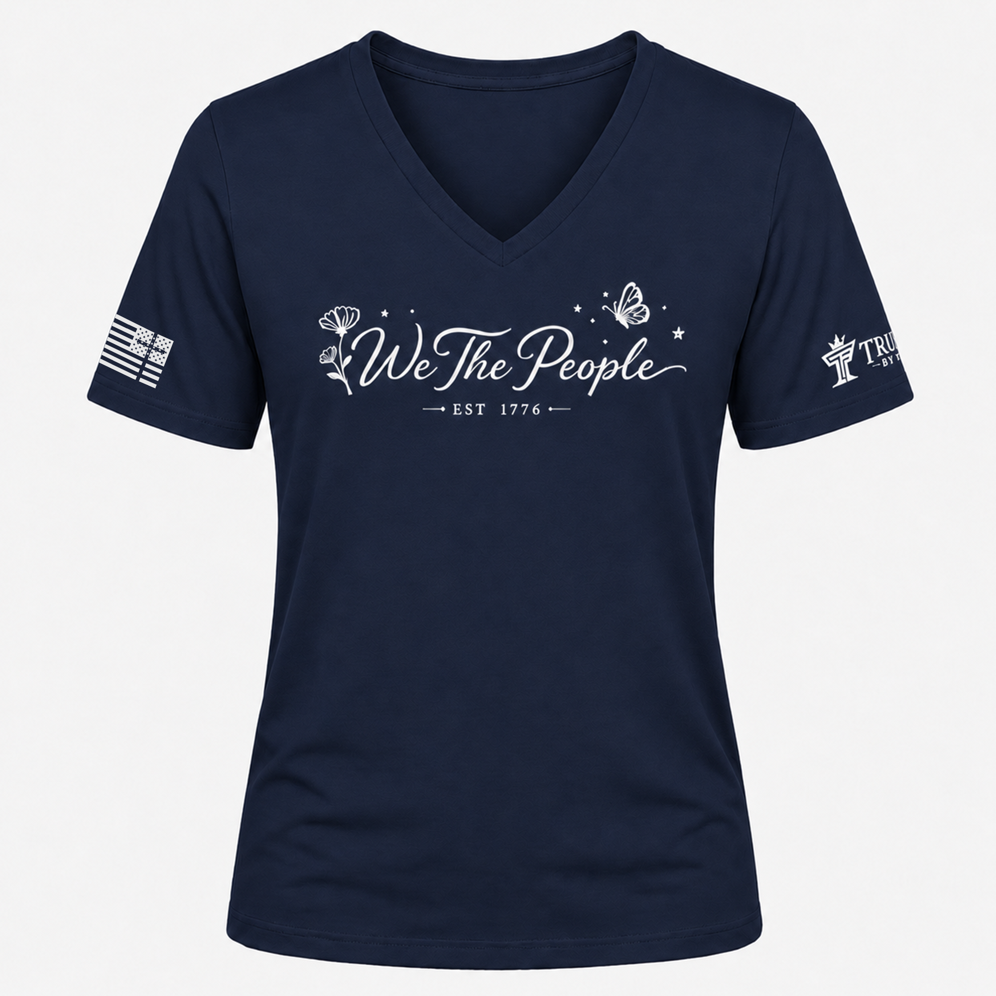 Navy We the People V-neck shirt with white patriotic script design, floral accents, butterfly, and EST 1776.