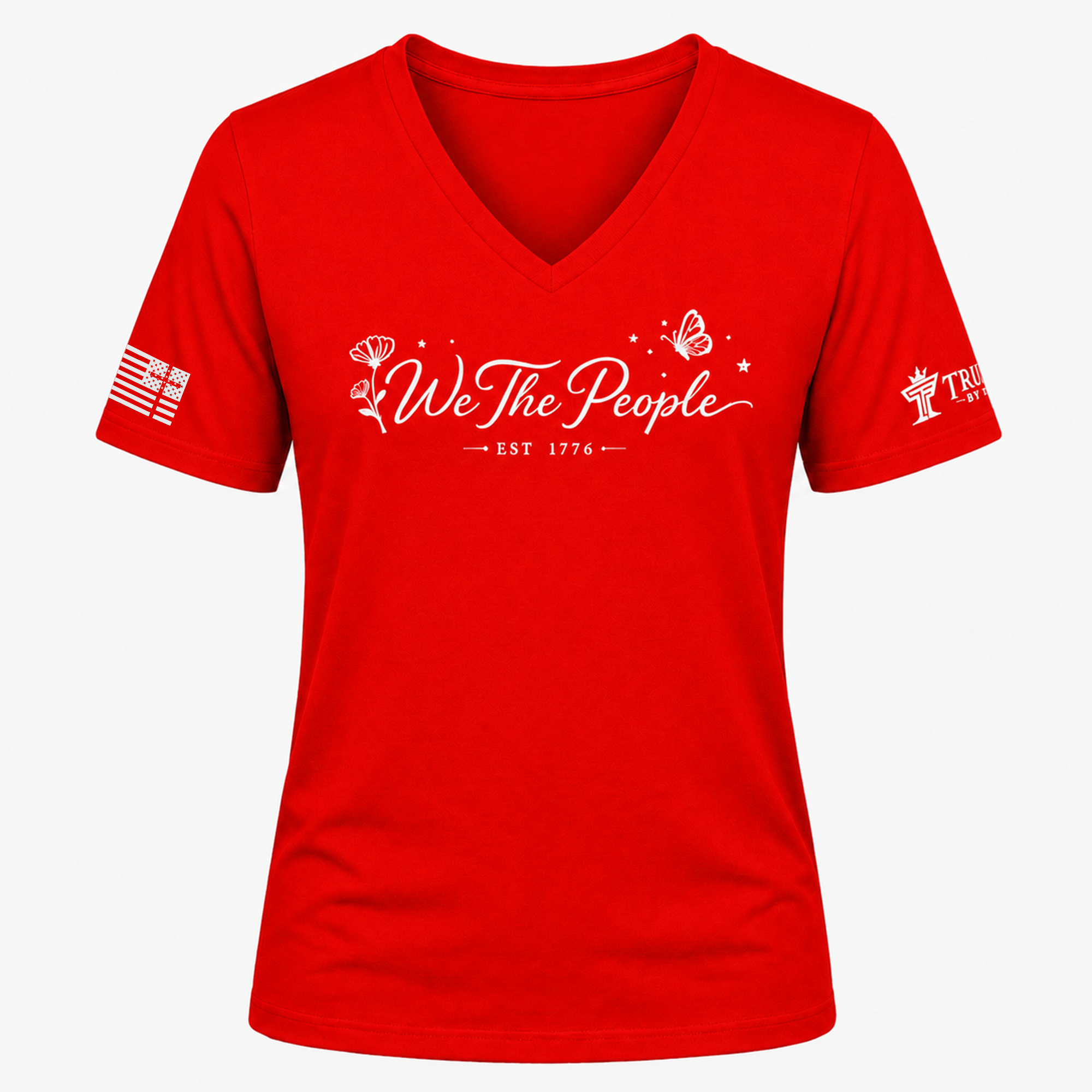 Red We the People V-neck shirt with white script lettering, flower detail, butterfly, and EST 1776.