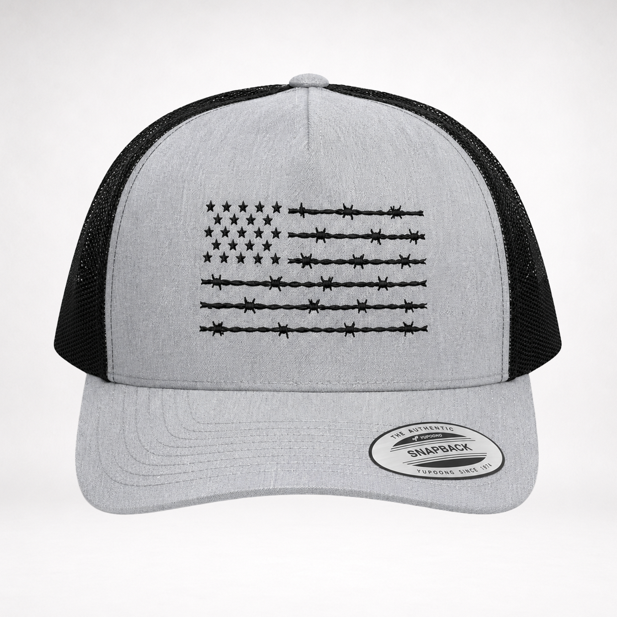 front view of barbed wire american flag trucker hat with heather gray crown and black embroidered flag design