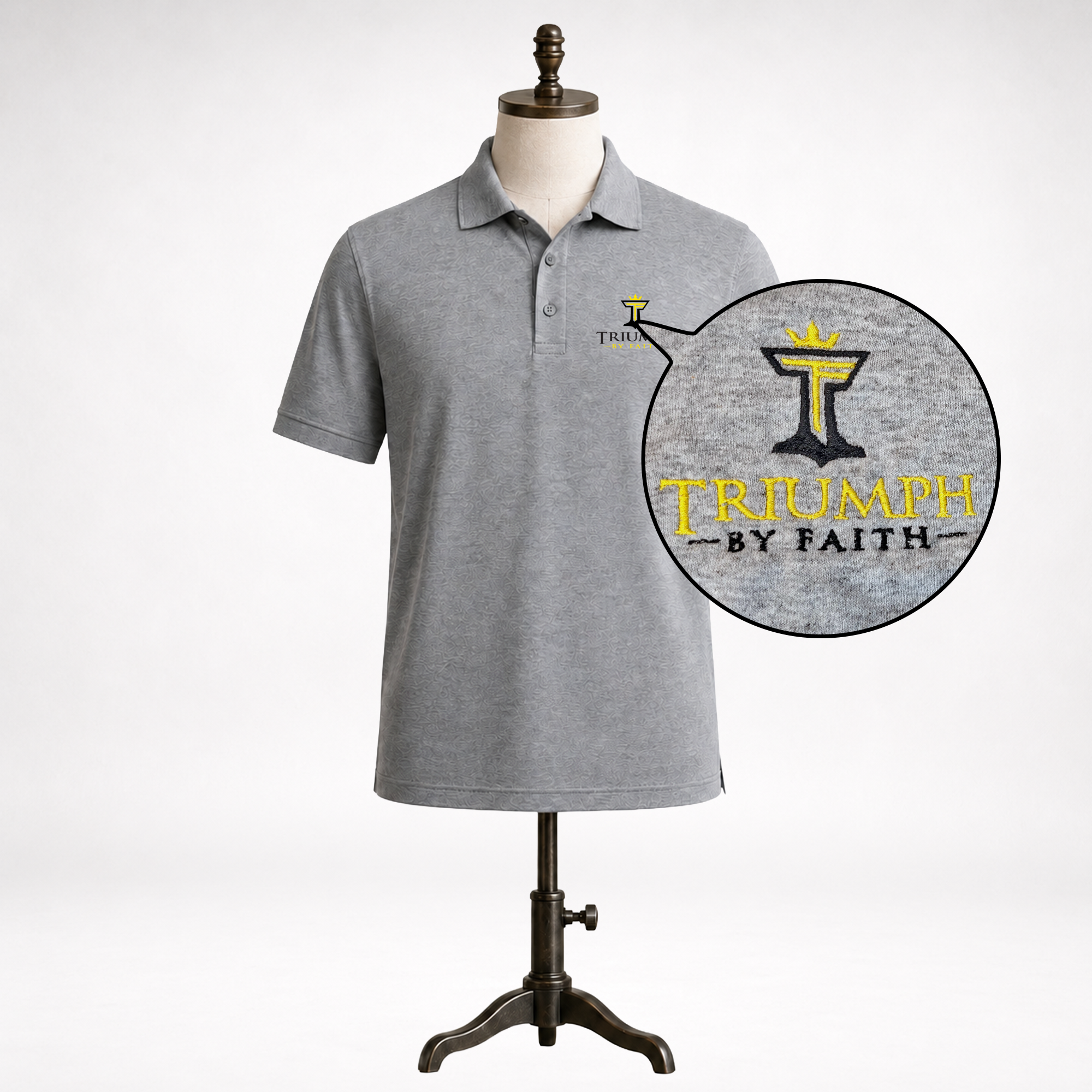 Close-up of the embroidered Triumph by Faith logo on a mens triumph athletic polo.