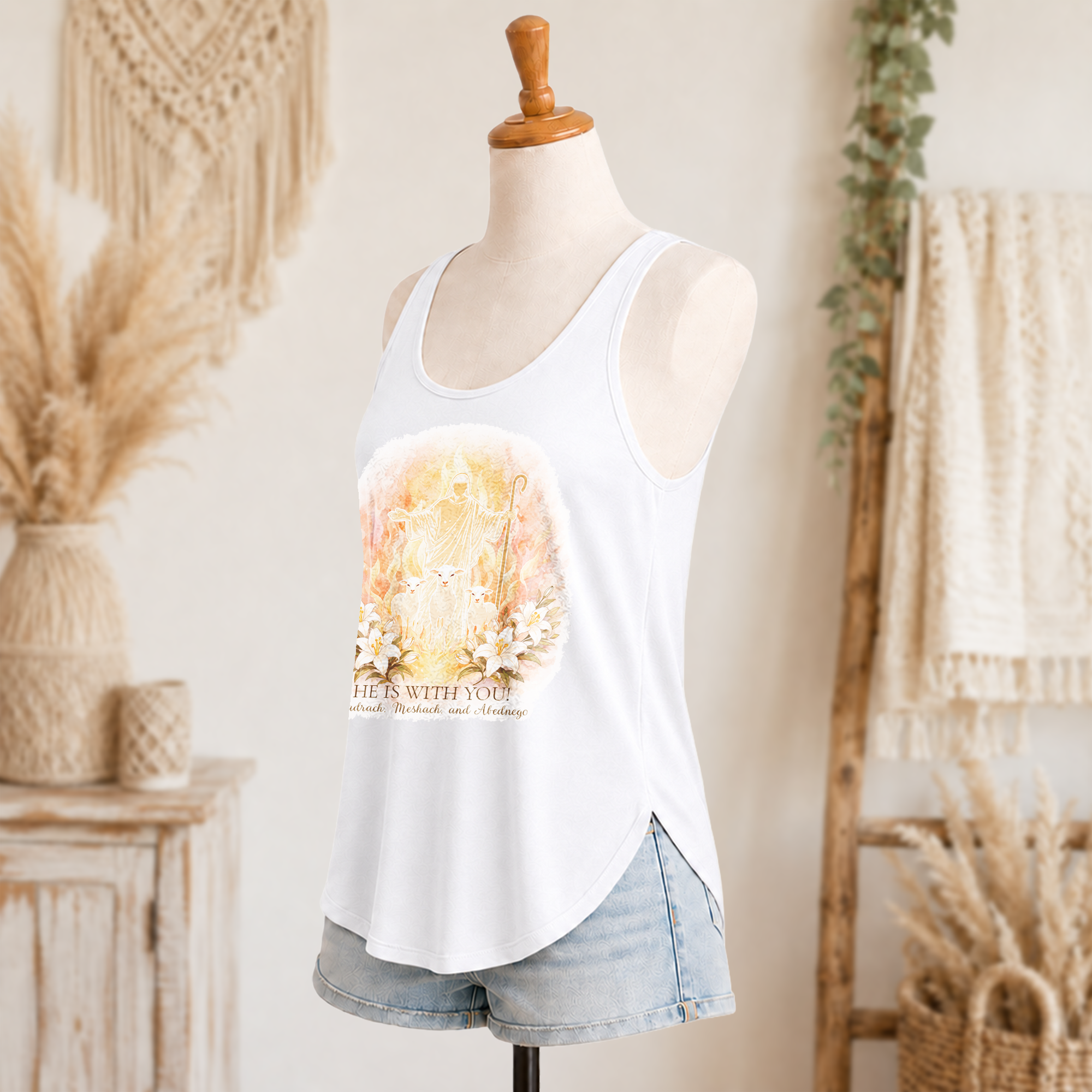 He is with You women’s festival tank side view in white with front Christian artwork and denim shorts