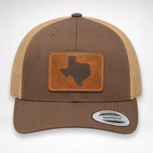 Front view of Texas Engraved Patch Trucker Hat with brown front panels, khaki mesh, and leather-style Texas patch.