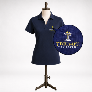 Close-up detail of embroidered Triumph by Faith logo on true navy womens Triumph jacquard polo